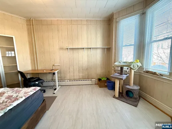 a room with a bed furniture and a window
