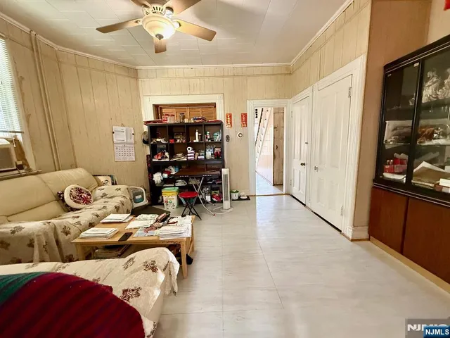 a bedroom with furniture and a chandelier