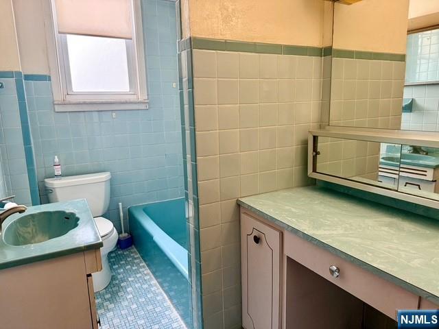 405 7th Street Harrison, NJ 07029 - Photo 8 of 21 a bathroom with a sink a toilet and a shower