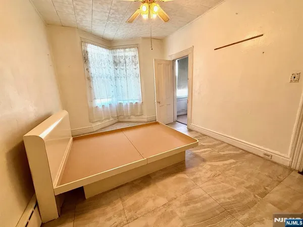 a living room with a couch and a chandelier