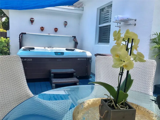 a living room with furniture and a mirror