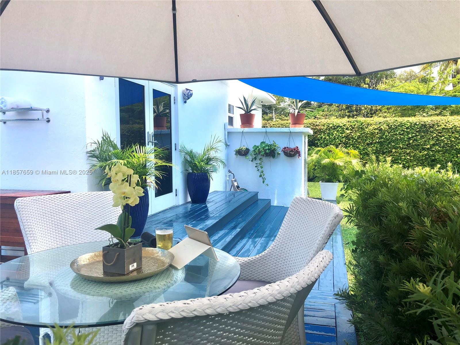 6450 Southwest 19th Street West Miami, FL 33155 - Photo 14 of 42 a dining room with furniture and a potted plant