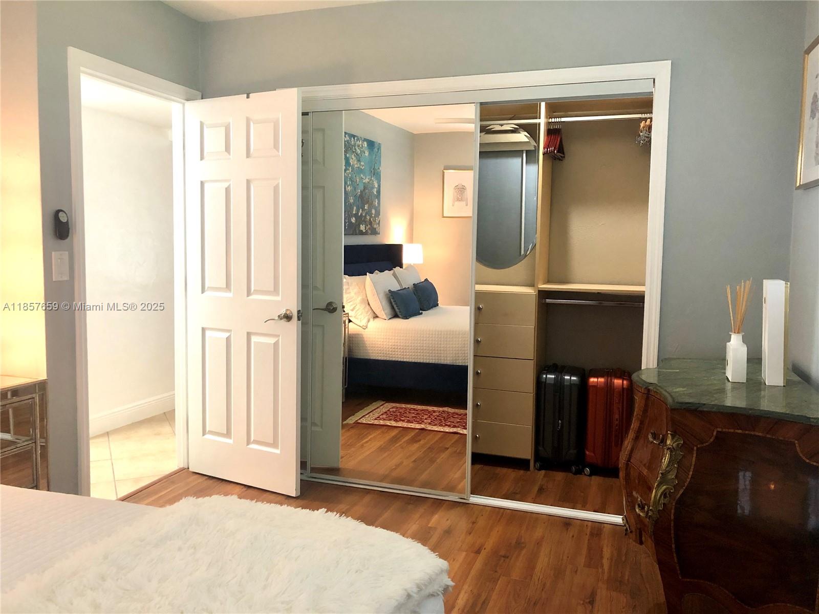 6450 Southwest 19th Street West Miami, FL 33155 - Photo 19 of 42 a bedroom with furniture and a window