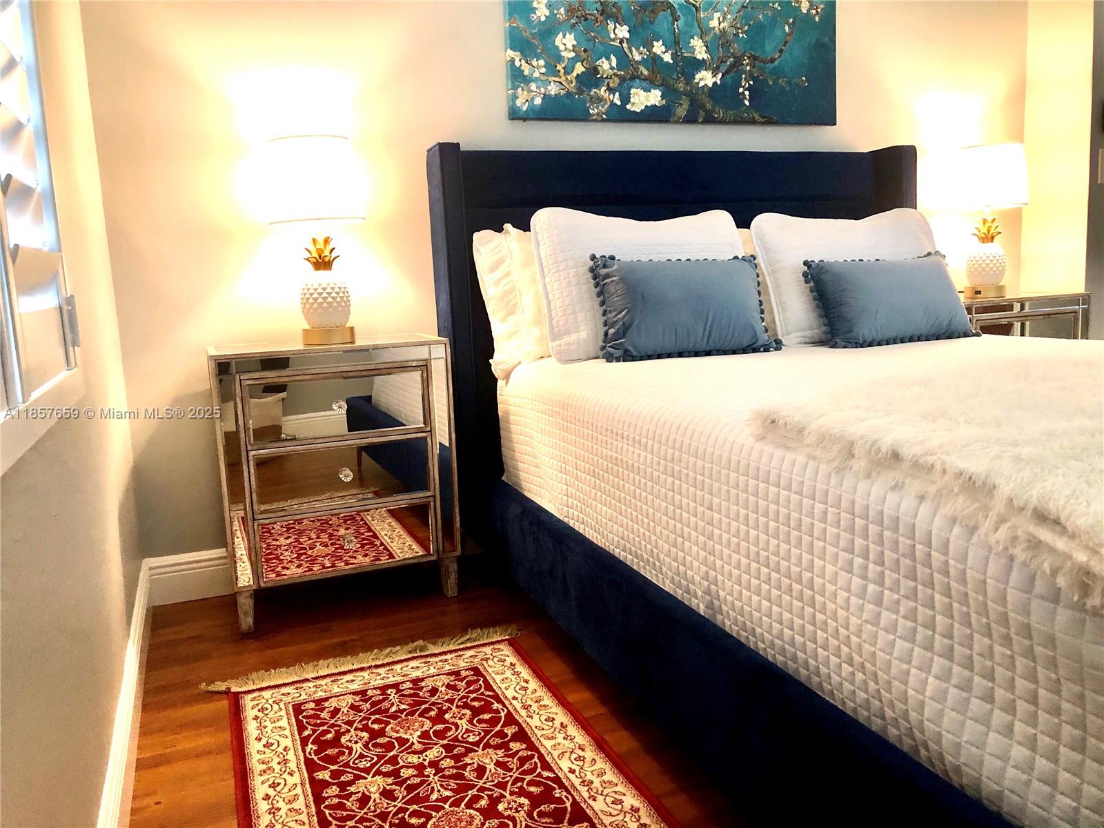 6450 Southwest 19th Street West Miami, FL 33155 - Photo 22 of 42 a bed sitting in a bedroom next to a window with outer view