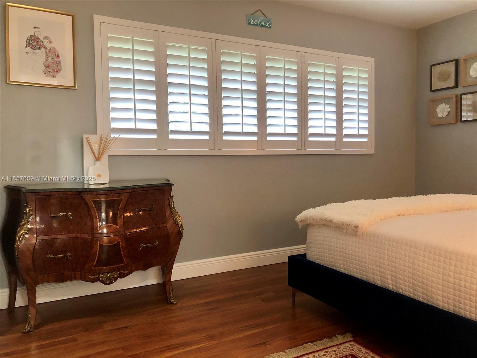 6450 Southwest 19th Street West Miami, FL 33155 - Photo 27 of 42 a bedroom with a bed and a window