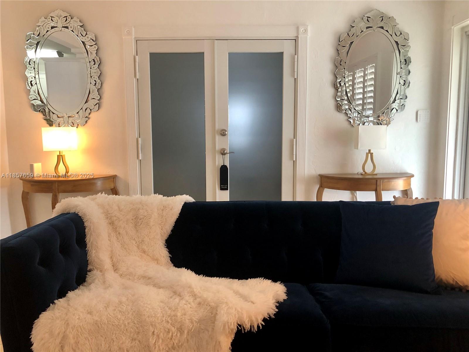 6450 Southwest 19th Street West Miami, FL 33155 - Photo 30 of 42 a bed sitting in a bedroom next to a window