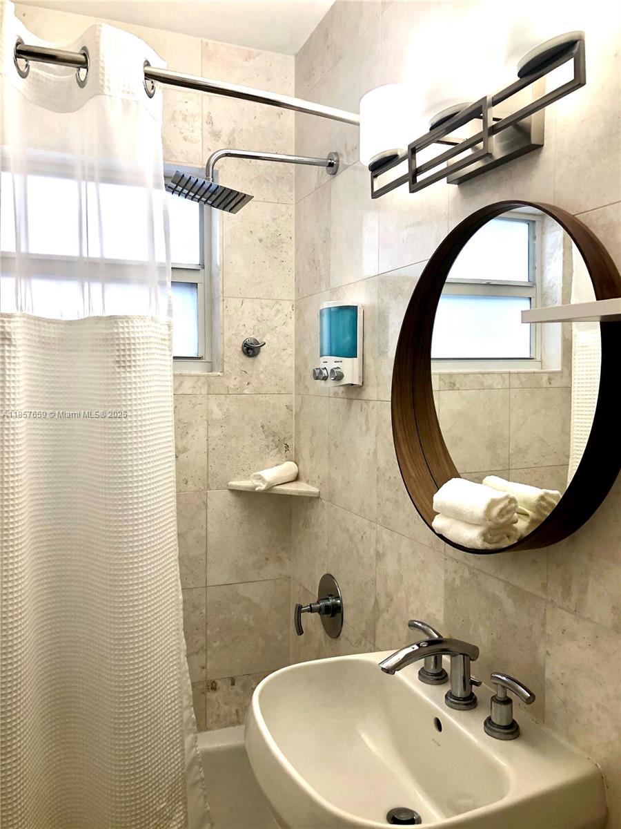 6450 Southwest 19th Street West Miami, FL 33155 - Photo 37 of 42 a bathroom with a sink and a mirror