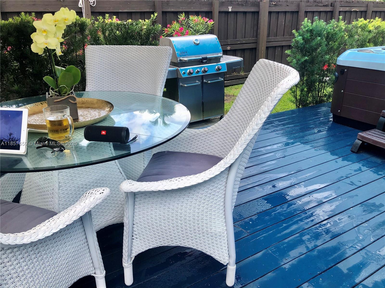 6450 Southwest 19th Street West Miami, FL 33155 - Photo 42 of 42 a table and chairs in wooden floor