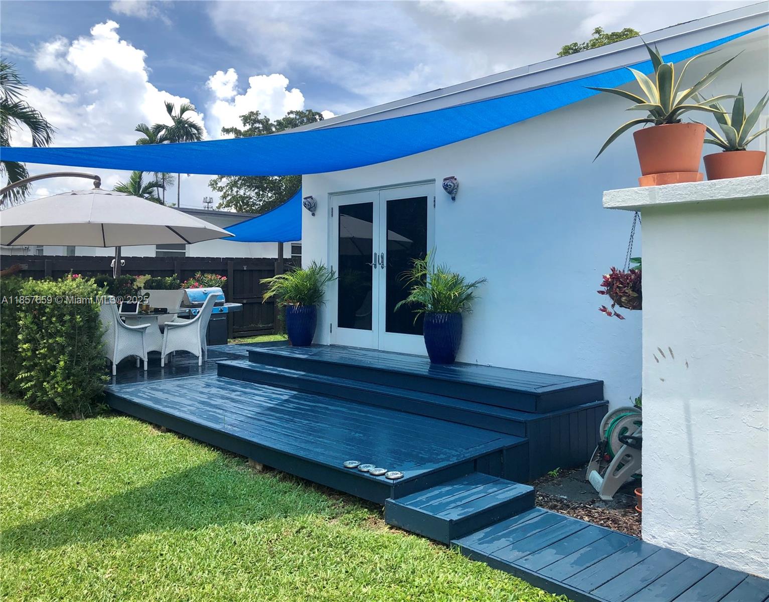 6450 Southwest 19th Street West Miami, FL 33155 - Photo 5 of 42 a view of an chairs and table in the patio
