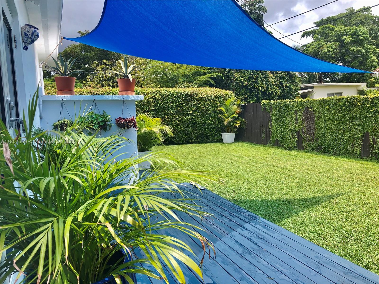 6450 Southwest 19th Street West Miami, FL 33155 - Photo 7 of 42 a view of a backyard with plants