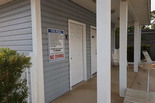 a view of front door and potted plants