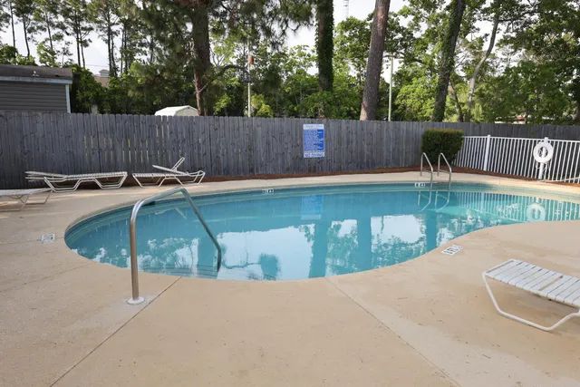 a view of a swimming pool with a patio