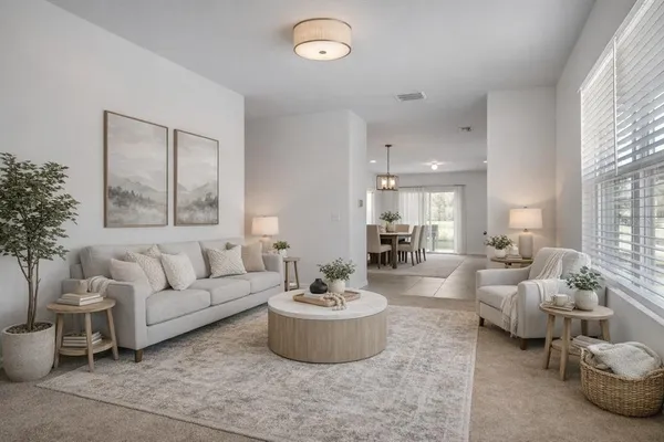 a living room with furniture and a large mirror