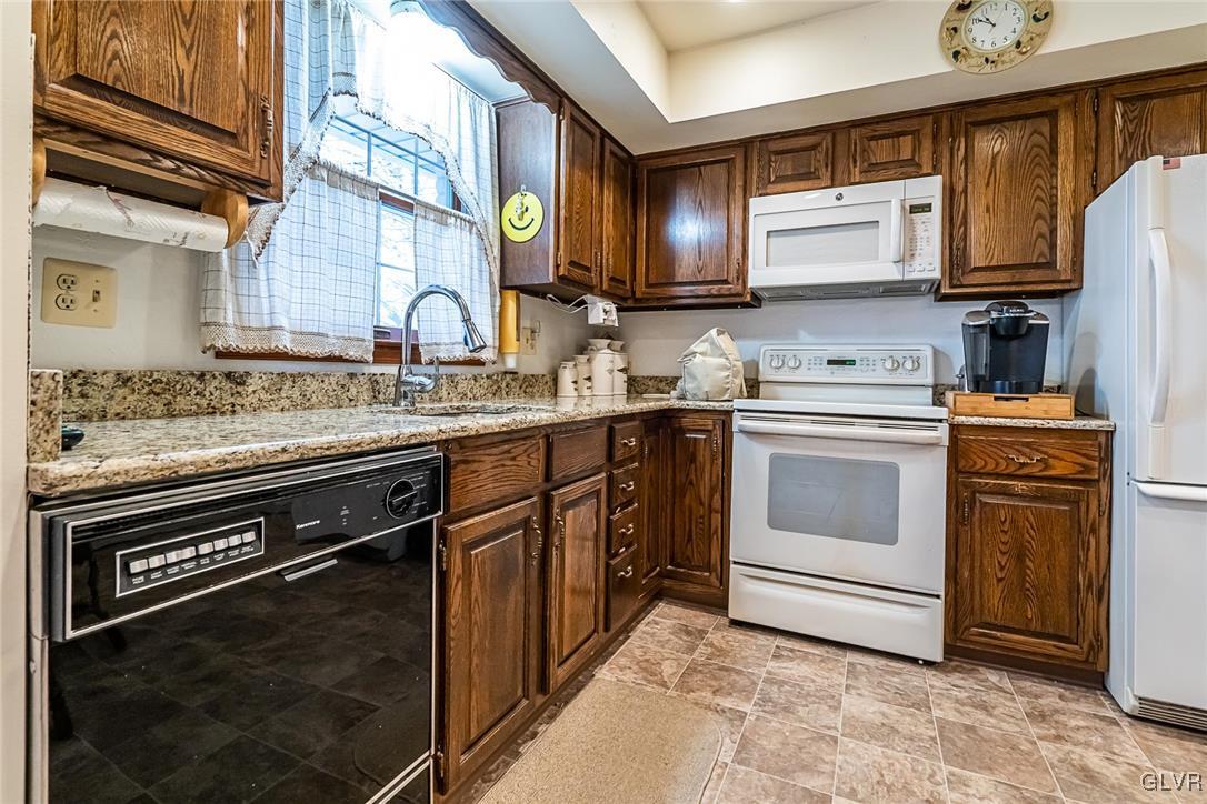 179 Kemmerer Road Nazareth, PA 18064 - Photo 21 of 38 a kitchen with a sink stove and microwave