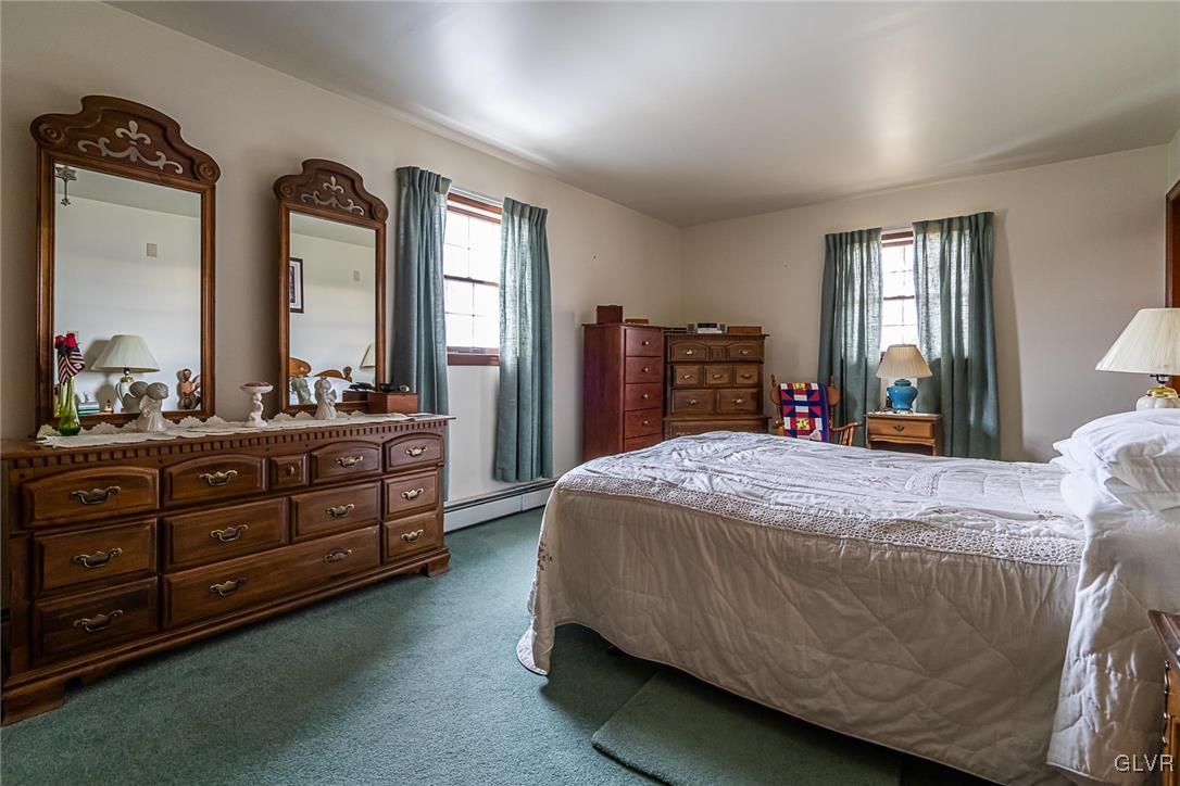 179 Kemmerer Road Nazareth, PA 18064 - Photo 25 of 38 a bedroom with a bed a dresser and mirror