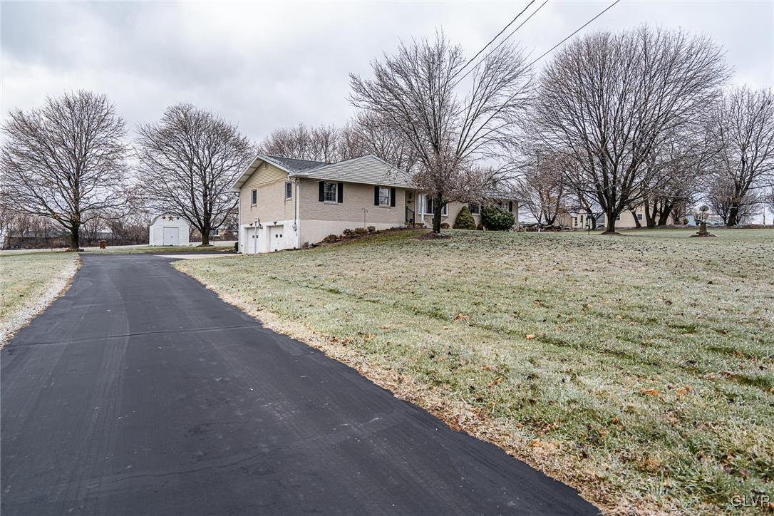 179 Kemmerer Road Nazareth, PA 18064 - Photo 4 of 38 a view of a yard with a large tree