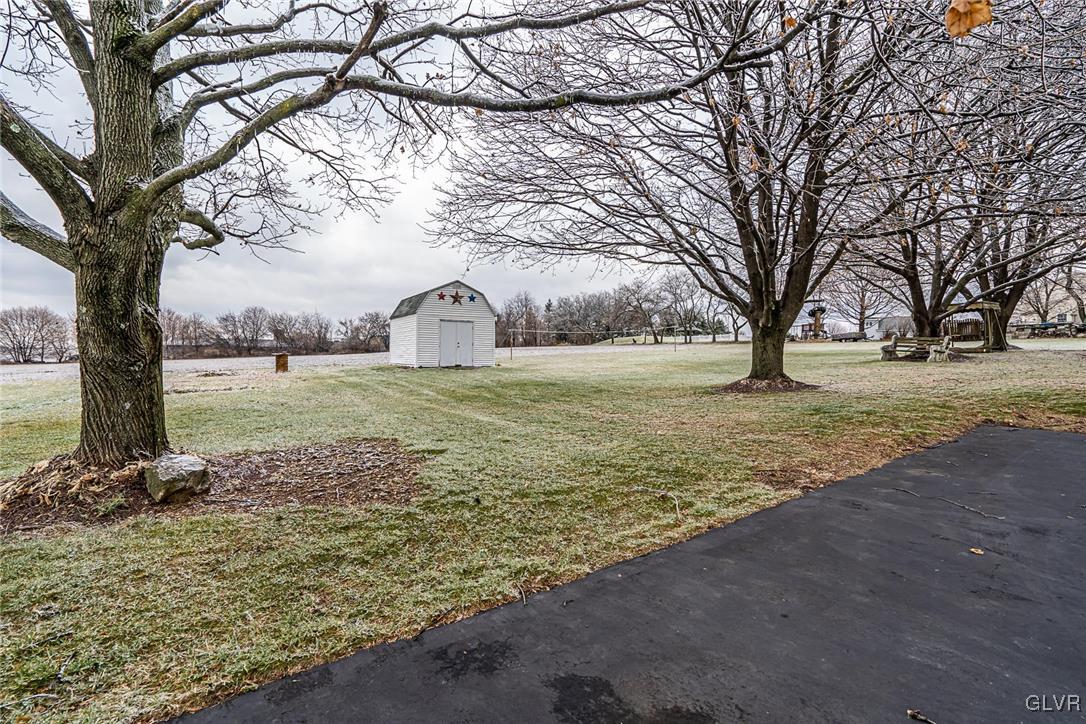 179 Kemmerer Road Nazareth, PA 18064 - Photo 7 of 38 a view of a yard with a tree