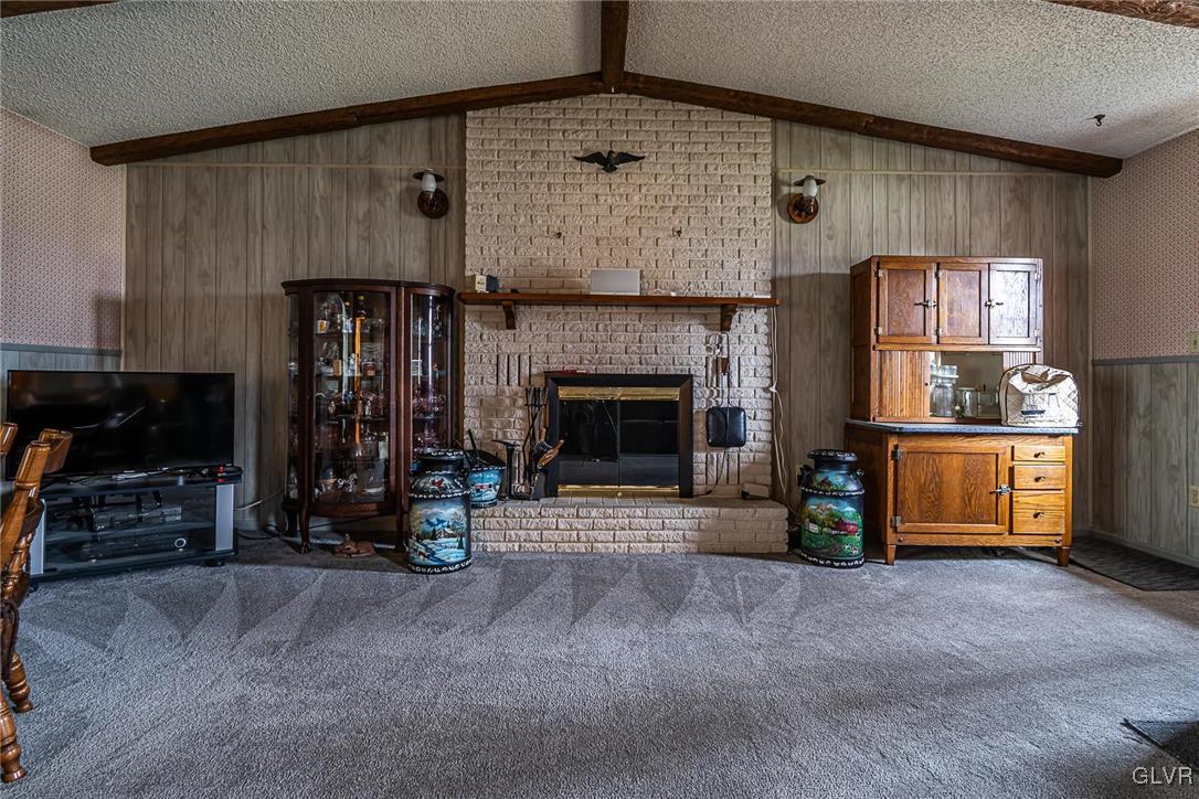 179 Kemmerer Road Nazareth, PA 18064 - Photo 10 of 38 a living room with furniture and a fireplace