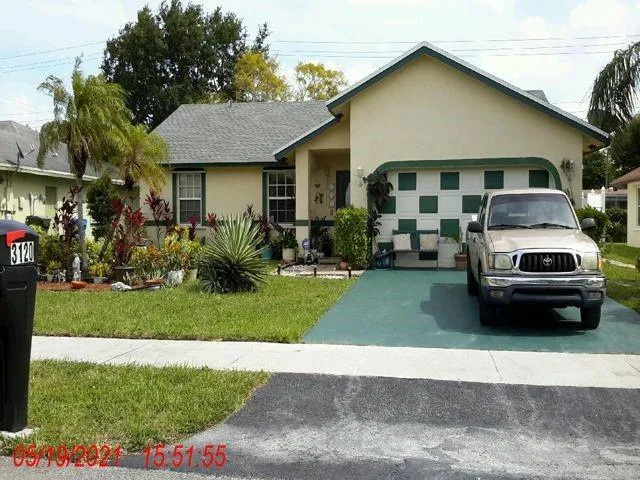 a car parked in front of a house