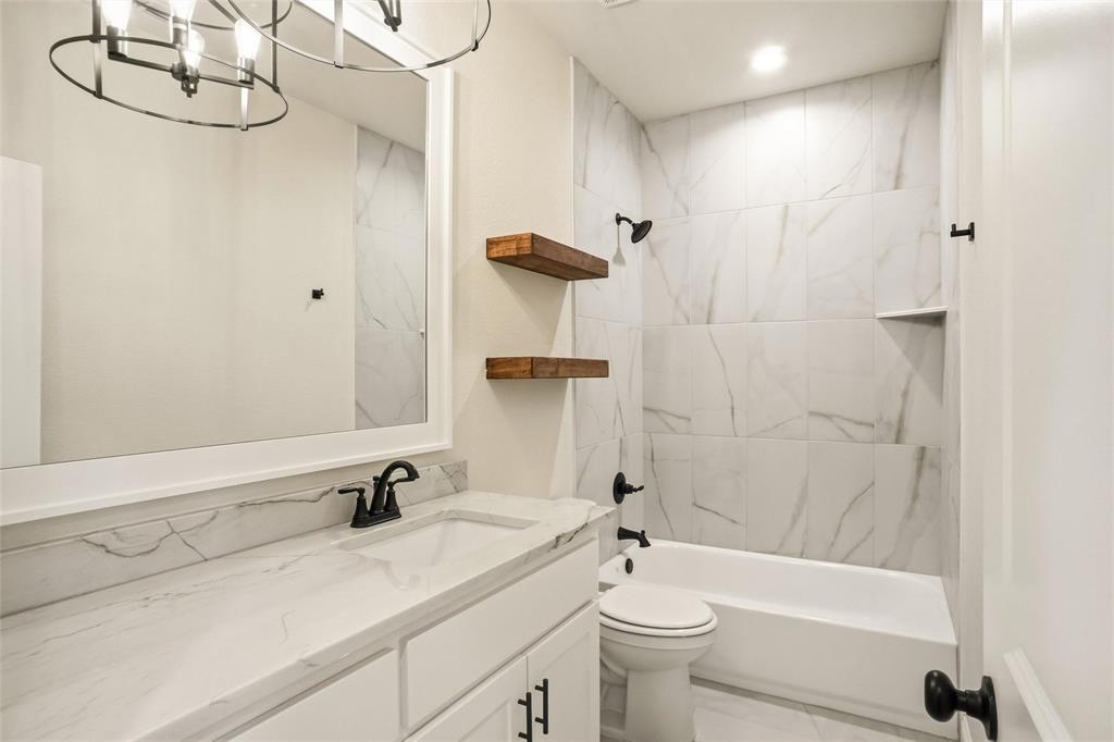 206 Legacy Boulevard Weatherford, TX 76086 - Photo 18 of 21 a bathroom with a sink a toilet and shower