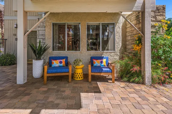 a view of pool table and chairs in patio