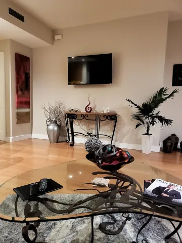 a room with furniture and a flat screen tv