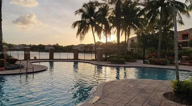 a view of a swimming pool with a patio