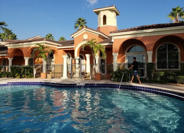 a front view of house with swimming pool