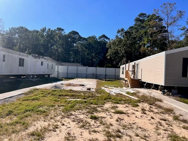 a view of a tub and trees in the background
