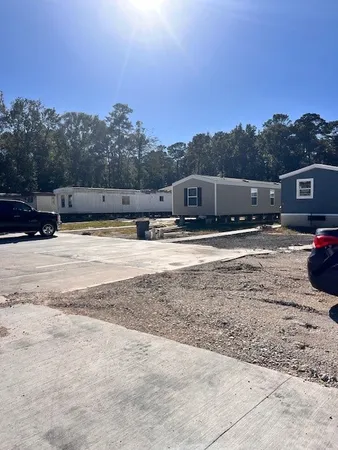 a view of a swimming pool with a yard