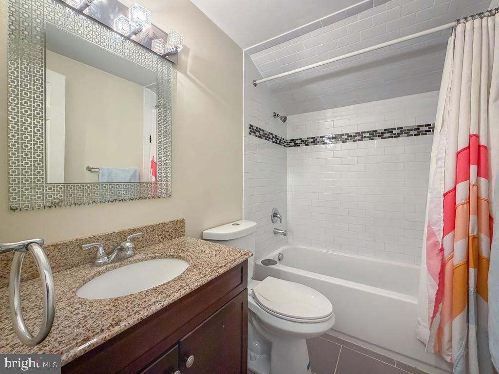 18 Jump Hill Road Levittown, PA 19056 - Photo 20 of 22 a bathroom with a granite countertop sink toilet and shower