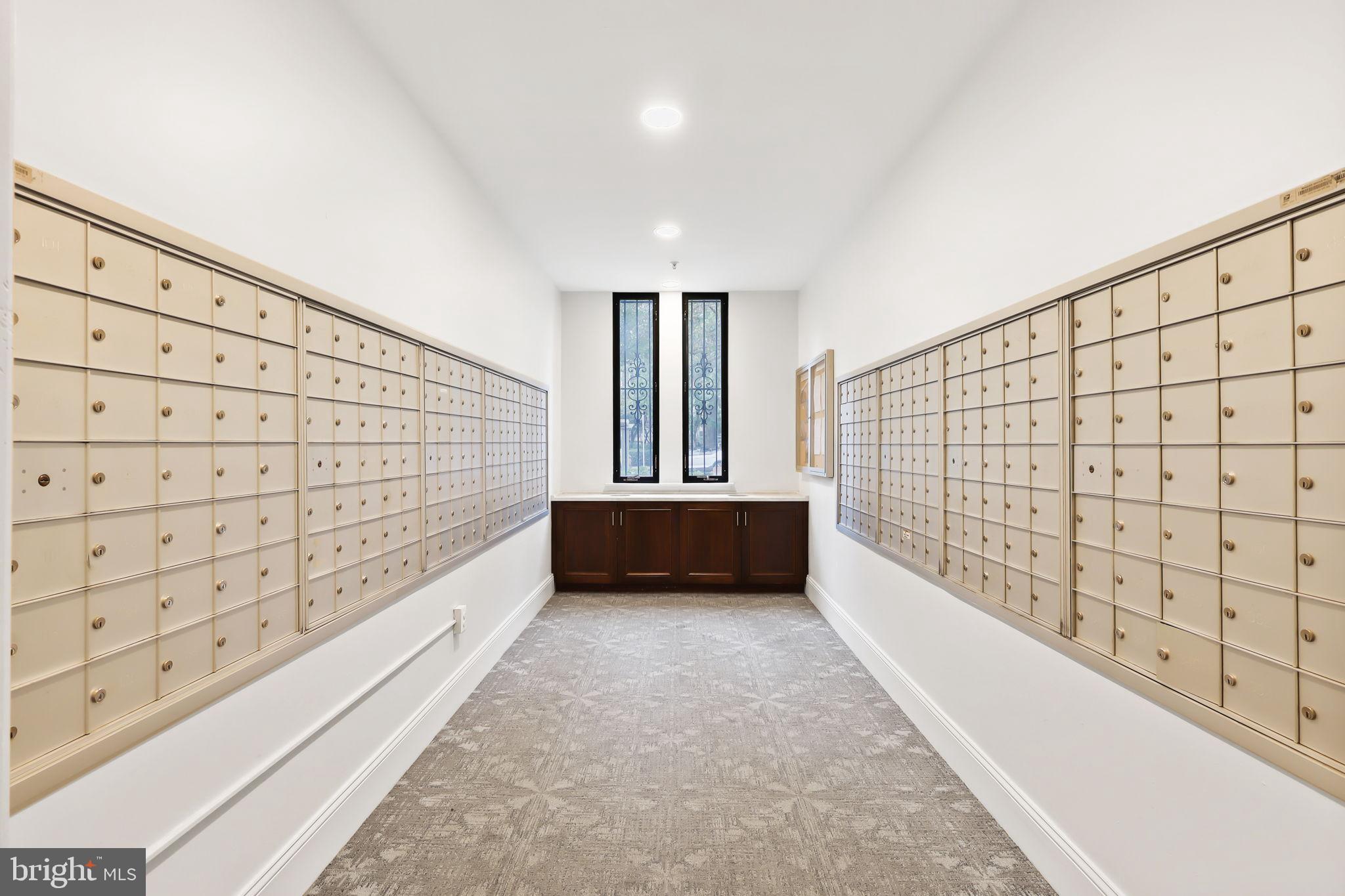 1701 16th Street Northwest, Unit 706 Washington, DC 20009 - Photo 27 of 29 Modern mailroom with organized lockers.