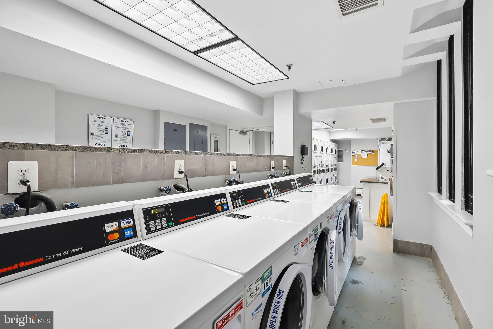 1701 16th Street Northwest, Unit 706 Washington, DC 20009 - Photo 28 of 29 Bright and efficient laundry facility space.