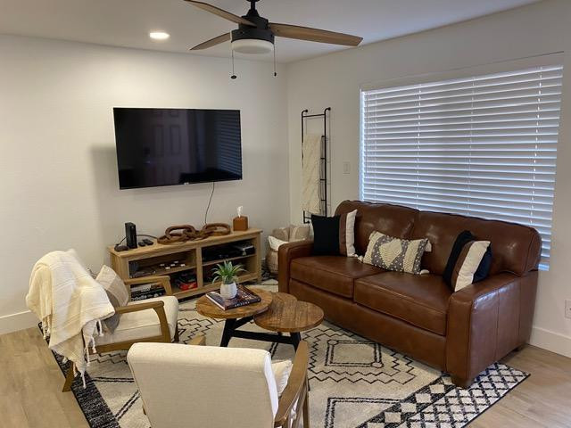 1440 North Idaho Road, Unit 2096 Apache Junction, AZ 85119 - Photo 2 of 7 a living room with furniture and a flat screen tv