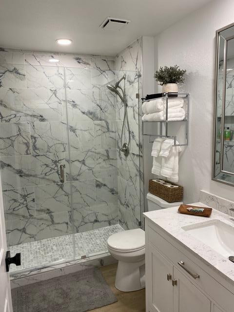 1440 North Idaho Road, Unit 2096 Apache Junction, AZ 85119 - Photo 3 of 7 a bathroom with a sink a toilet and shower