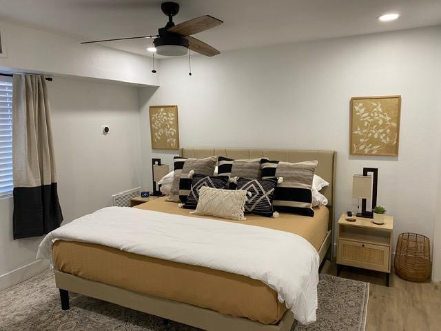 1440 North Idaho Road, Unit 2096 Apache Junction, AZ 85119 - Photo 4 of 7 a large bed sitting in a bedroom next to a window