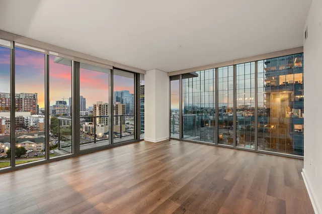 a view of a room with wooden floor