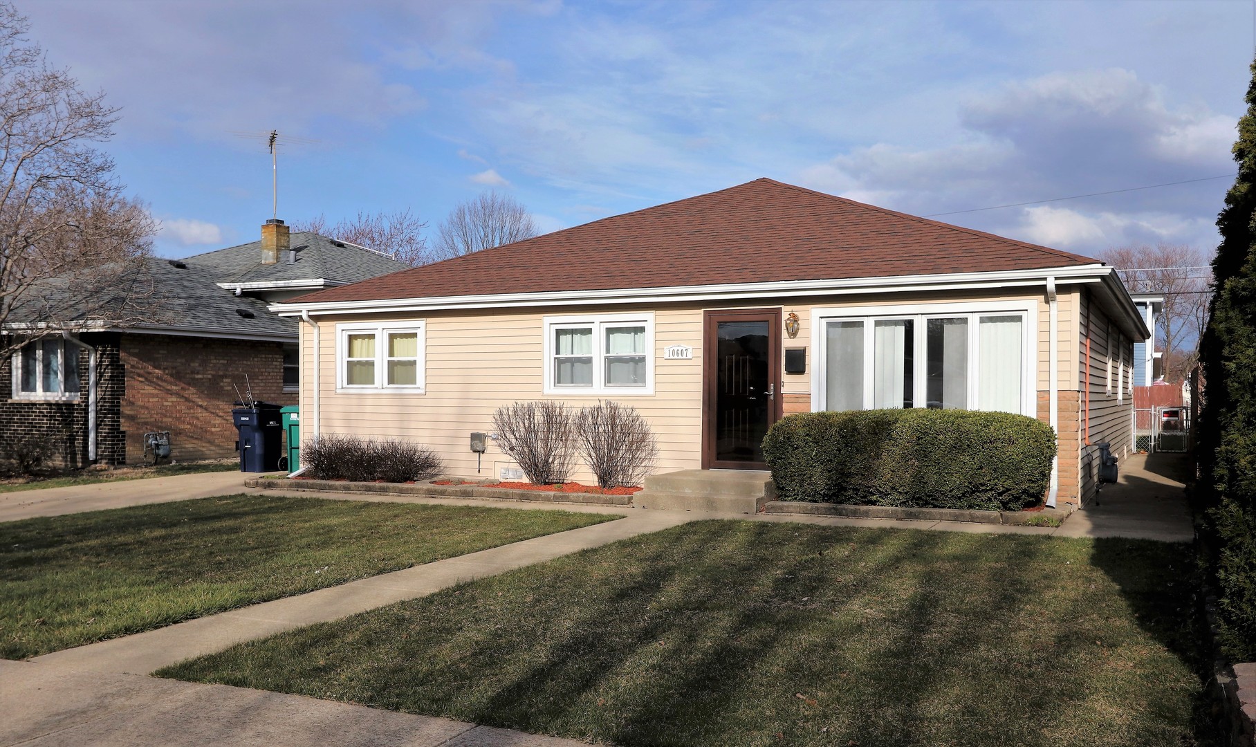 10607 Princess Avenue Chicago Ridge, IL 60415 - Photo 1 of 25 a front view of a house with a yard
