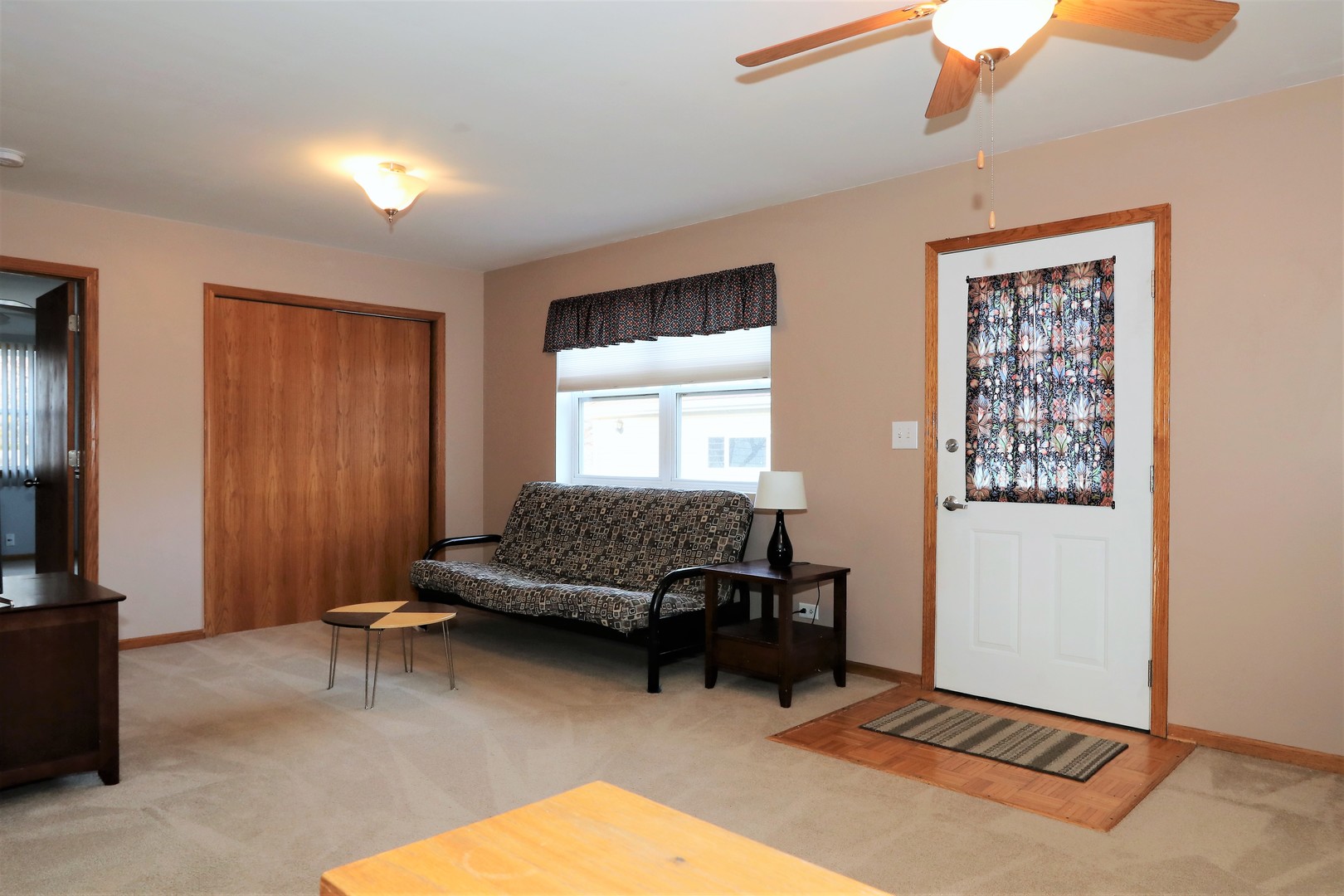 10607 Princess Avenue Chicago Ridge, IL 60415 - Photo 11 of 25 a living room with furniture gym equipment and a window