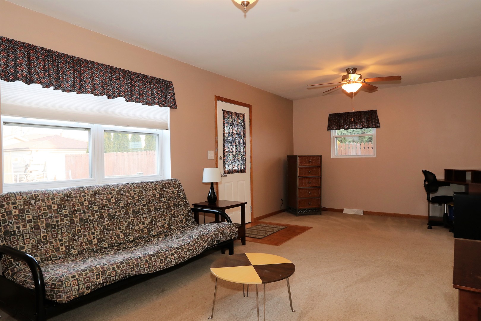 10607 Princess Avenue Chicago Ridge, IL 60415 - Photo 12 of 25 a living room with furniture and a window