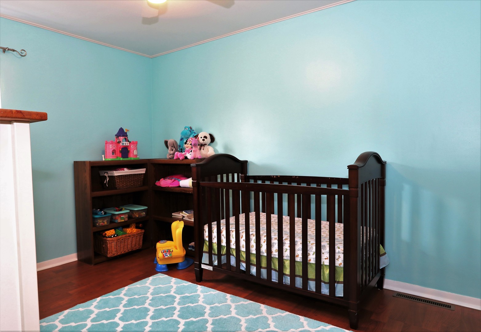 10607 Princess Avenue Chicago Ridge, IL 60415 - Photo 14 of 25 a bedroom with a bed and a chandelier