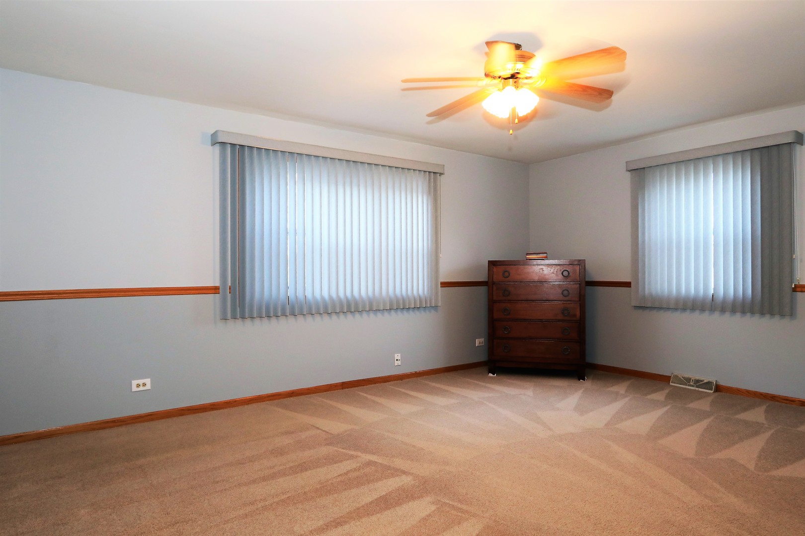 10607 Princess Avenue Chicago Ridge, IL 60415 - Photo 18 of 25 a view of an empty room with window and chandelier fan