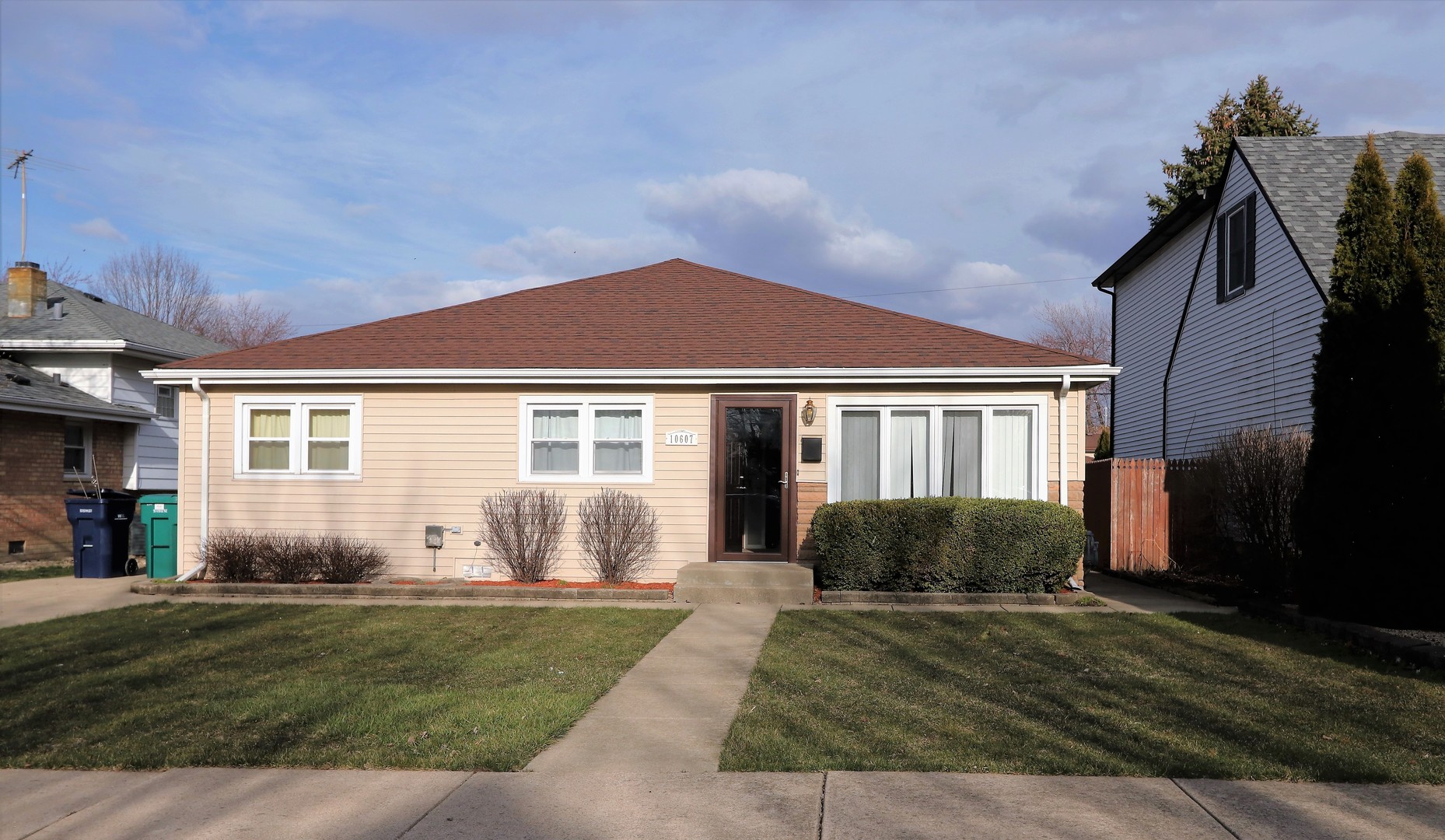 10607 Princess Avenue Chicago Ridge, IL 60415 - Photo 2 of 25 a front view of a house with garden