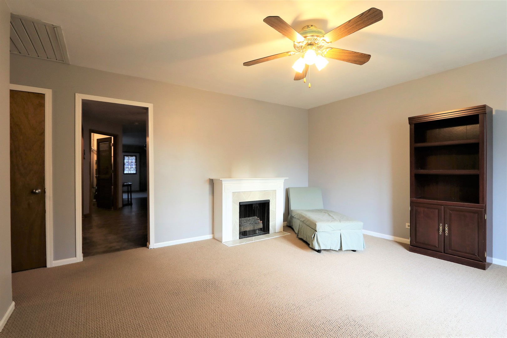 10607 Princess Avenue Chicago Ridge, IL 60415 - Photo 4 of 25 a living room with furniture and a fireplace