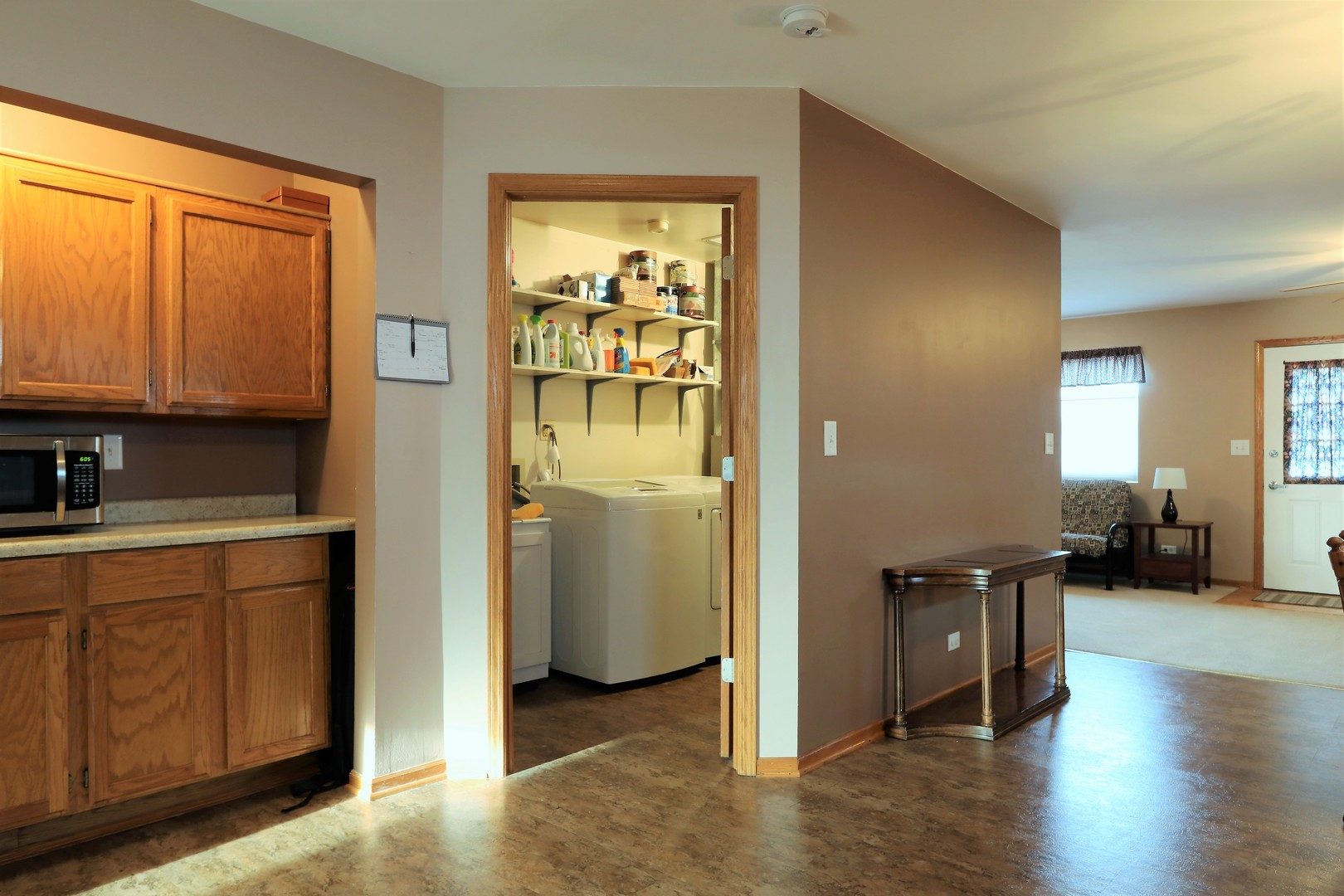 10607 Princess Avenue Chicago Ridge, IL 60415 - Photo 6 of 25 a view of a hallway with wooden floor and furniture
