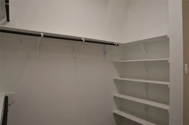 a view of an empty walk in closet