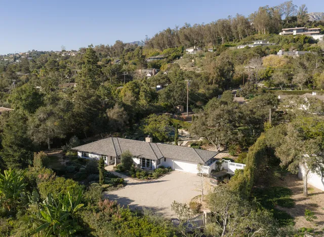 a view of a town with mountains in the background