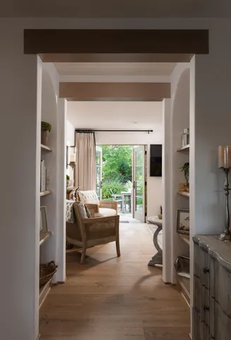 a living room with furniture and a window