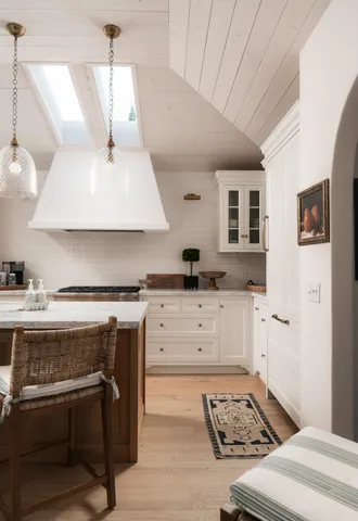 a kitchen with a stove a sink and a refrigerator