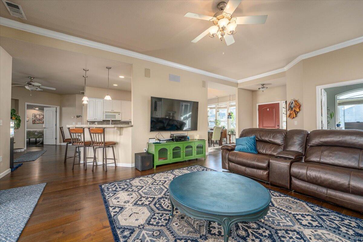 2122 Edinburgh Way Redding, CA 96003 - Photo 11 of 61 a living room with furniture a flat screen tv and a table